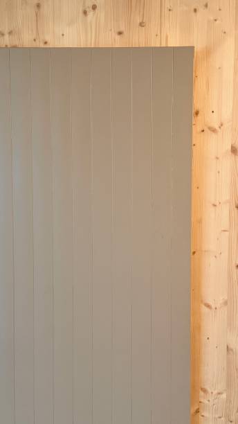 istock Grey radiator on a wooden wall 2172149355