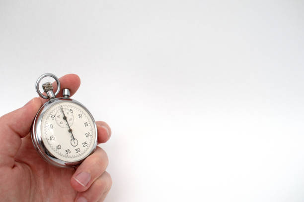 istock Hand holding a mechanical stopwatch. 2172149905