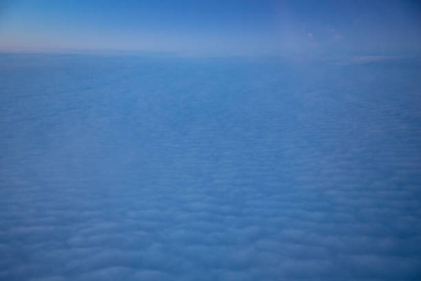China Shanghai - Sunrise above the clouds from the plane