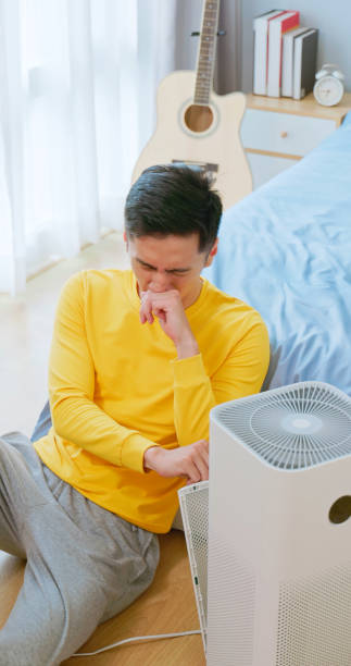 istock Male unhappy air purifier dirt 2172157506