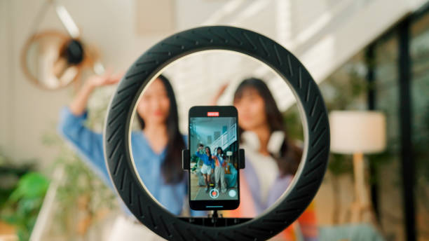 istock Two young Asian women creating a video content by dancing in their studio. 2172159131