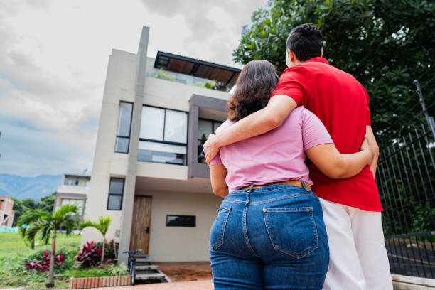 istock Couple embracing and looking for their new house 2172159271