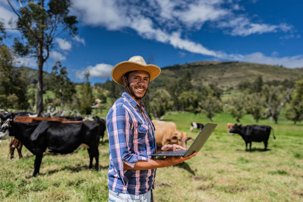istock Portrait of a young man using laptop on a farm 2172162369