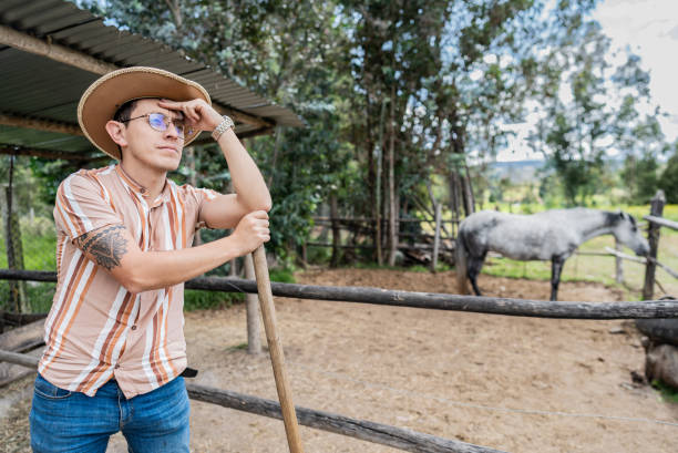 istock Young man contemplating on a farm 2172162457