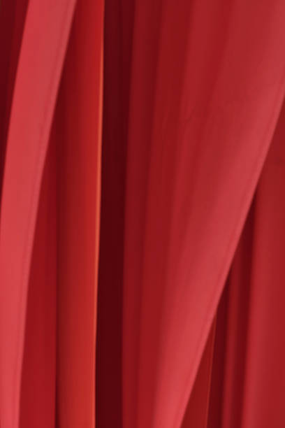 istock Red silk flags and folds in fabric 2172164020