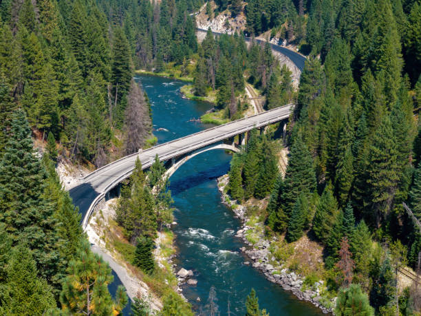 istock Idaho highway winds through a forest and over a river 2172166341