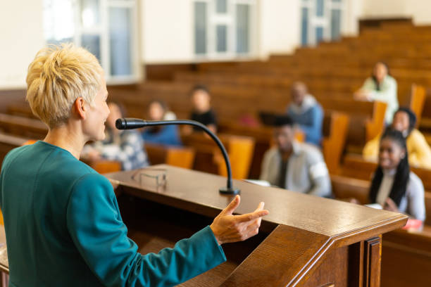 istock Woman lecturer giving a presentation 2172167993