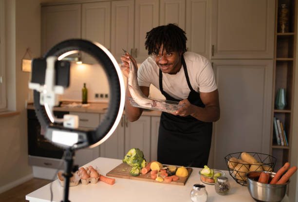 istock Holding a fish up for the camera 2172168387