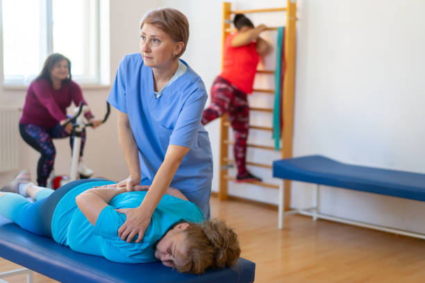 istock Patient gets physiotherapy leg stretching 2172168814