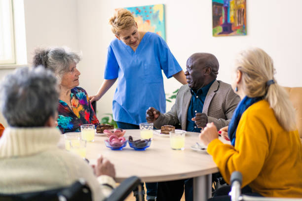 istock A nurse talking to nursing home residents 2172169482