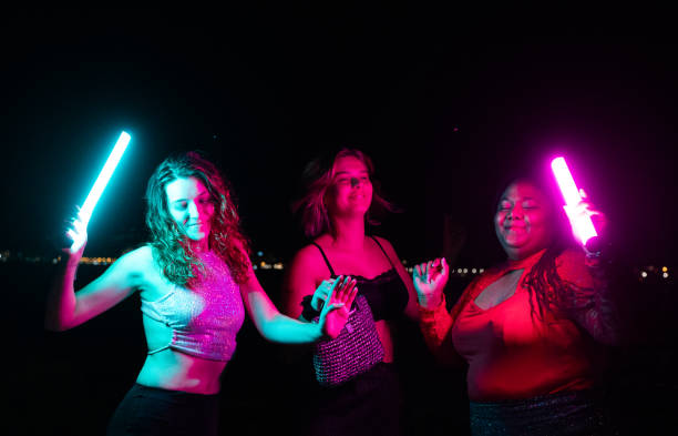 istock Women dancing together at beach party 2172170270