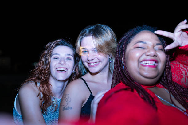 istock Three women enjoying nightlife in the beach 2172170327