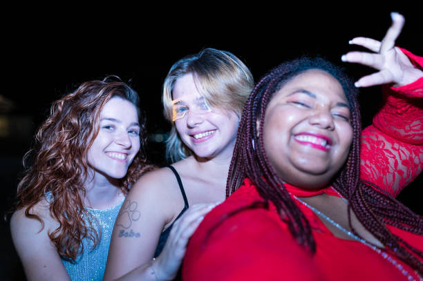 istock Happy diverse friends dancing and enjoying night beach party 2172170353
