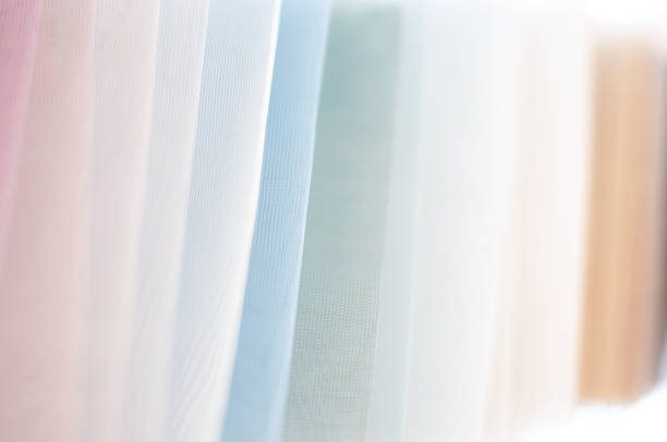 Brown fabric drapes forming a textured stage curtain background