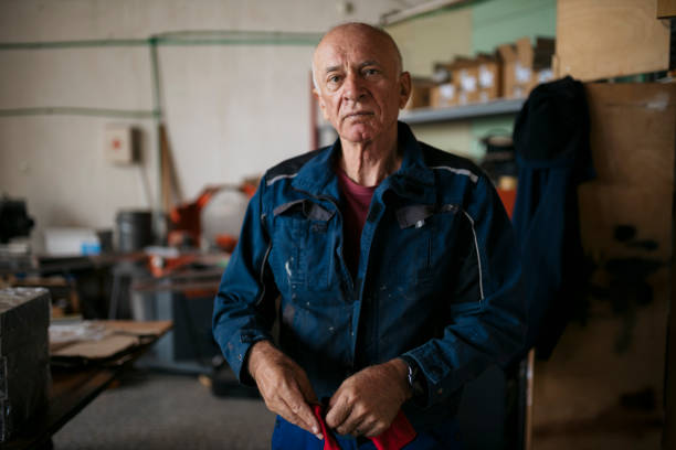 istock Portrait of a confident senior man wearing protective workwear standing in workshop 2172174384