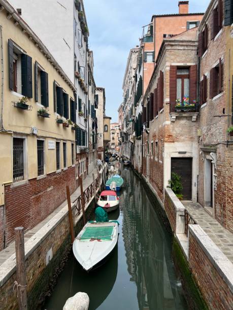 istock Boats lining a Venice Canal 2172175198