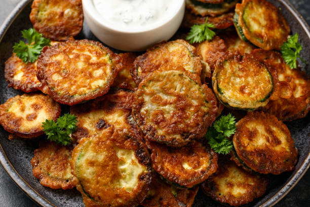 istock Crispy fried zucchini in butter with sauce 2172175962