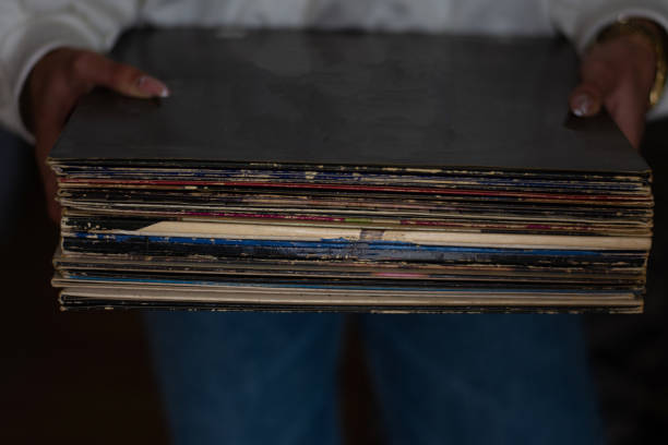 Woman  holding old vinyl retro records