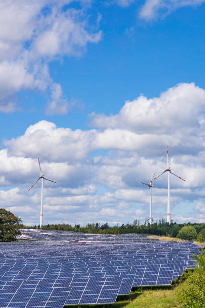 istock modern solar panels and wind turbines in a rural landscape 2172179837