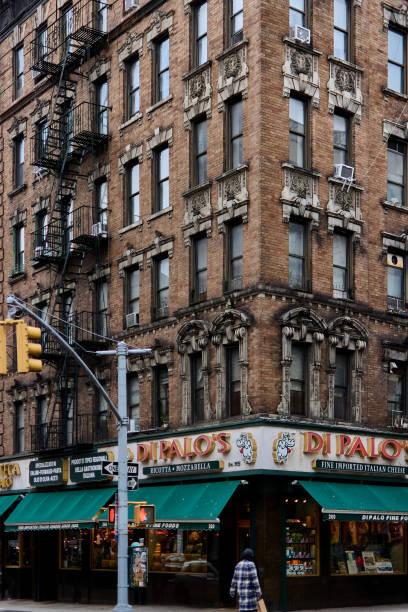 New York, United States -September 15,2024: View of a street in Chinatown, New York, featuring old buildings and shops showcasing the traditional architecture and urban life of the neighborhood.