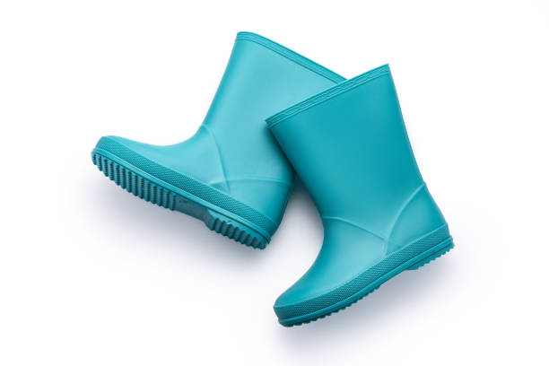 Blue rubber boots isolated on white background. Kids shoes for water.