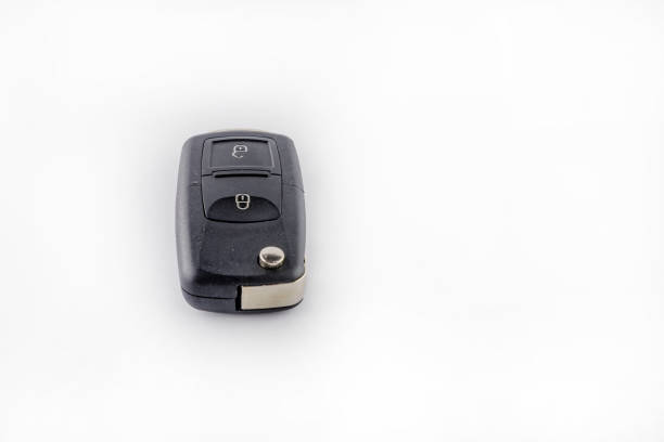 Car keys on a white background in a protective case, securing the car against theft by a car thief
