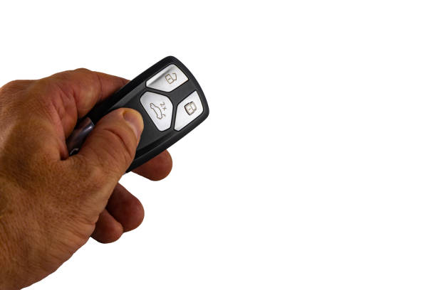 Car keys on a white background in a protective case, securing the car against theft by a car thief