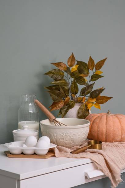 istock Rustic Kitchen Decor featuring a charming Pumpkin, ceramic bowl with dough, eggs, sugar, milk for backery, perfect for autumn 2172188668