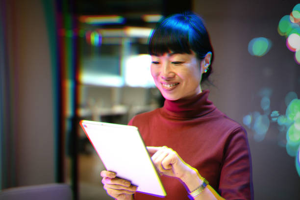 istock Japanese mature businesswoman using modern AI based technologies in the office 2172192121