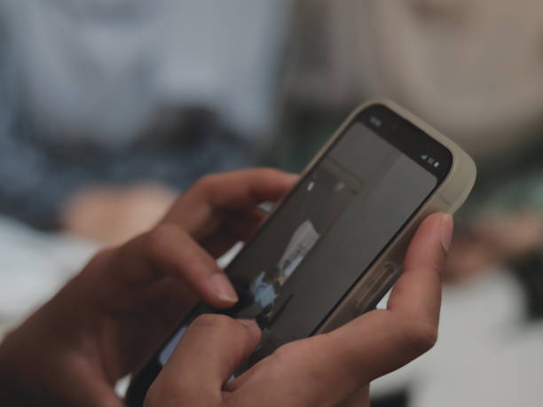 istock A person is casually scrolling through their smartphone. 2172194078