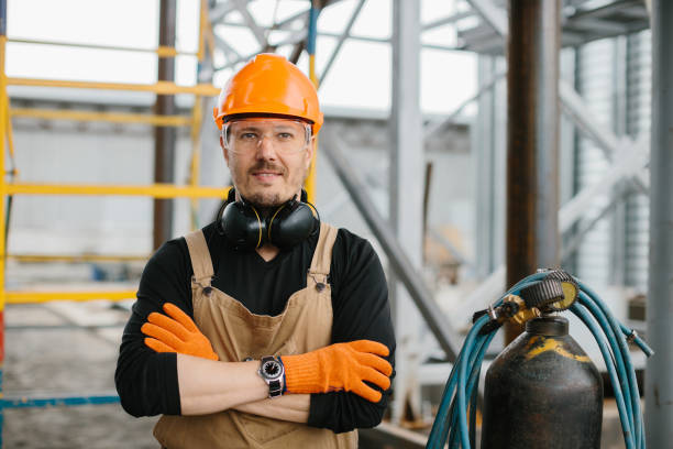 istock The assembly worker stands near the autogen on the construction site. A look at the camera. 2172206825