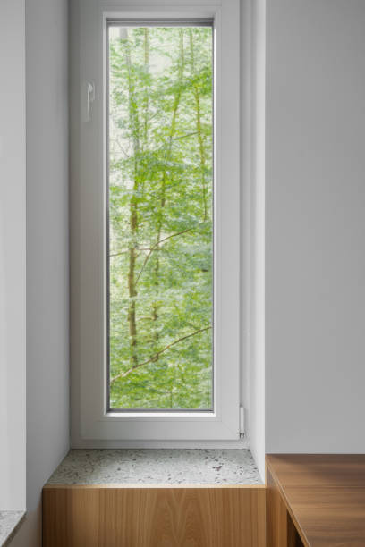 istock Natural light streams through a white plastic window in modern apartment 2172208384