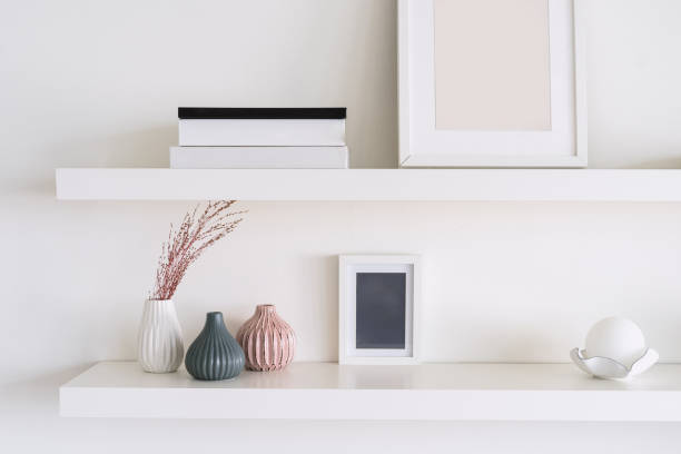 istock Modern minimalist shelf display with decorative vases and art 2172208428