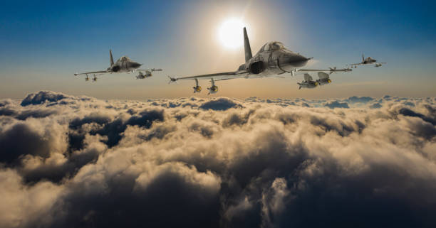 istock Jet aircrafts flying over the clouds. 2172208478