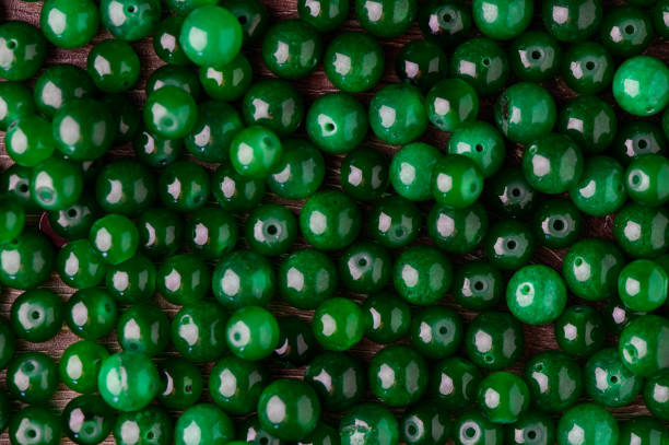 istock green balls of real stone for making magic amulets as a background 2172225487