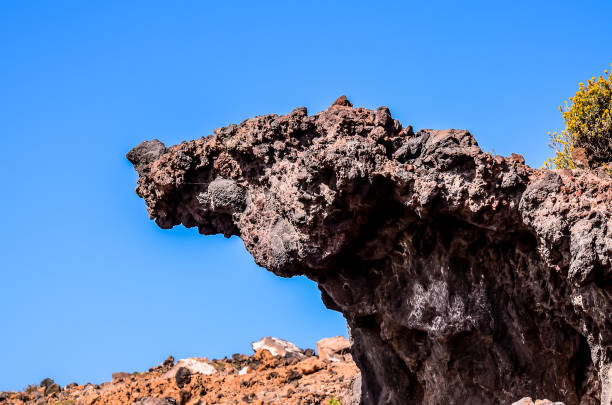 istock A large rock formation with a blue sky in the background 2172232517