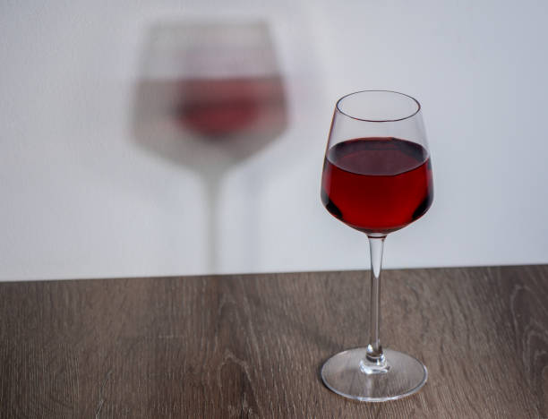 istock Elegant glass of red wine on kitchen table background. 2172234891