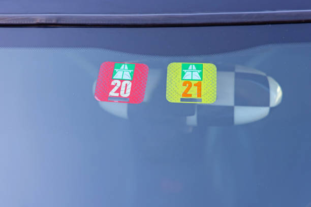 Two Swiss Road Tax Vignette Stickers at Car Windscreen Switzerland