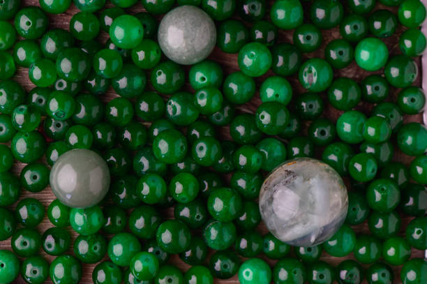 istock green beads made of real stone as a background 2172241034