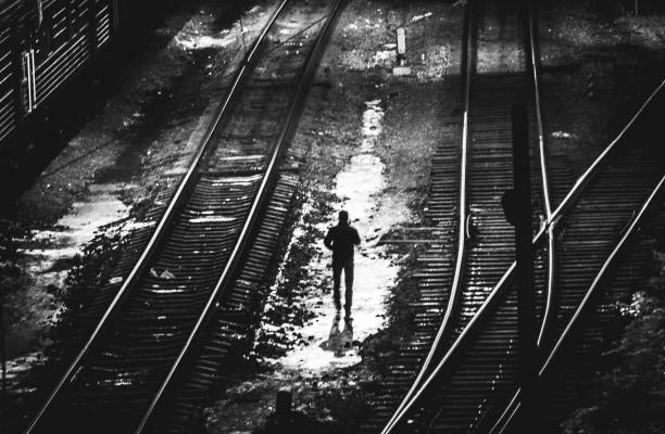 lone man at depot train station at winter night (soft focus)