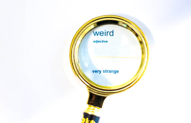 Magnifying Glass On Dictionary Definition for WEIRD