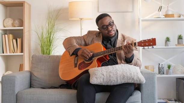 istock Guitar practice musician leisure man playing home. 2172253898
