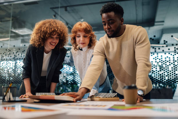 istock Diverse businesspeople working on solar energy implementation at office 2172254111
