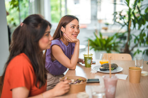 istock Diverse Coworkers Enjoying Healthy Lunch Bowls at Work 2172256898
