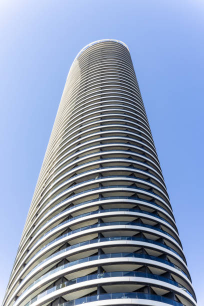 Modern apartment building against blue sky, background with copy space, full frame vertical composition, Broadbeach, Gold Coast Queensland