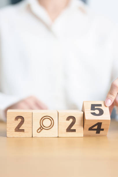 istock 2024 year change to 2025 year block with magnifying glass icon. SEO, Search Engine Optimization, hiring , Advertising, Idea, Strategy, marketing, Keyword, Content and New Year start concepts 2172276496