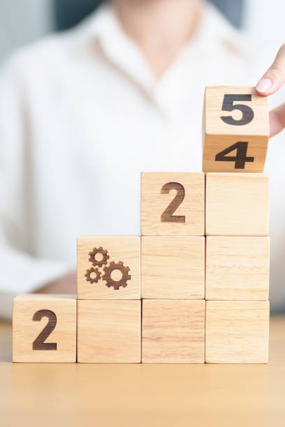 istock 2024 year change to 2025 year block with gear icon. Business Process, Team, teamwork, Goal, Target, Resolution, strategy, plan, Action, motivation, change, brainstorm and New Year start concepts 2172276531