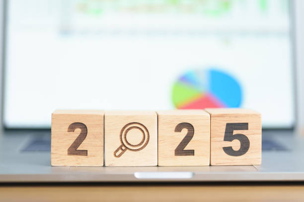istock 2025 Year block with magnifying glass icon against laptop computer. SEO, Search Engine Optimization, hiring , Advertising, Idea, Strategy, marketing, Keyword, Content and New Year start concepts 2172277273