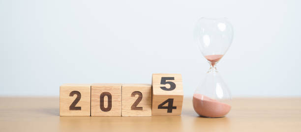 istock 2024 end year to Happy New Year 2025 with hourglass on table. Resolution, time, plan, goal, motivation, reboot, countdown and New Year holiday concepts 2172277407