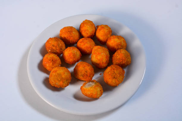 istock Close up of fried chicken nuggets on a ceramic plate 2172278119